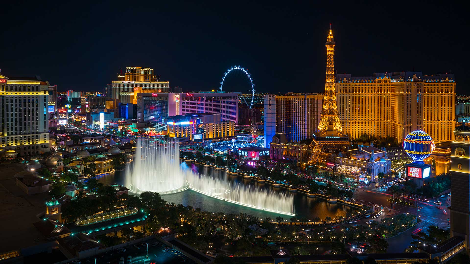 Las Vegas Strip illuminated at night with hotels and city lights.